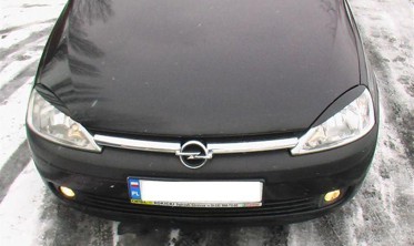 Накладки на передні фари Opel Corsa C фото