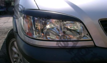 Накладки на передні фари Opel Zafira A фото