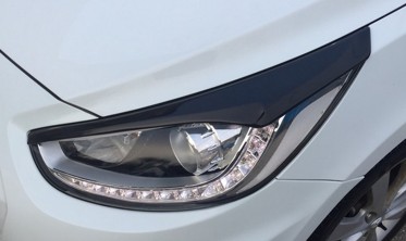 Накладки на фари Hyundai Accent фото