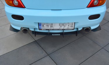 Центральний диффузор заднего бампера Hyundai Tiburon MK2 FACELIFT фото