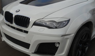 Накладки на фари BMW X6 E71 з вигинами фото