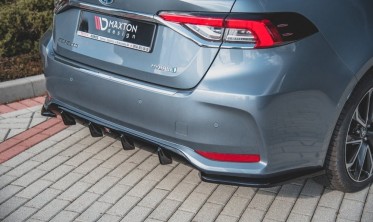 Центральная накладка на задний бампер Toyota Corolla XII седан фото