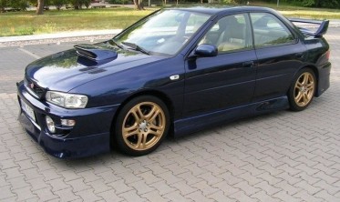 тюнінг накладки на бічні пороги Subaru Impreza J-SPEC фото