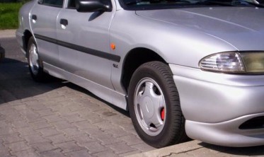 Накладки на пороги Ford Mondeo I/II стиль ST фото