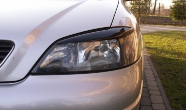Накладки на передние фары Opel Astra G фото