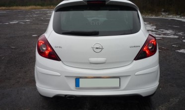 Тюнинговая накладка заднего бампера Opel Corsa D стиль OPC фото