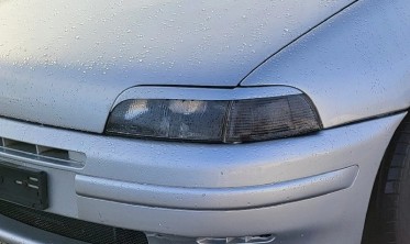 Накладки на передние фары Fiat Punto I фото