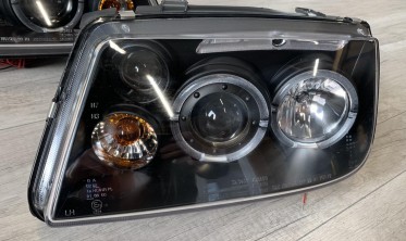 Фары передние тюнинговые VW Bora черные с кольцами фото
