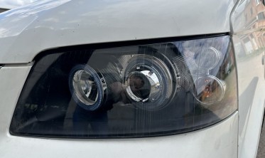 Тюнинговые фары передние VW T5 дорестайл с ангельскими глазками  фото