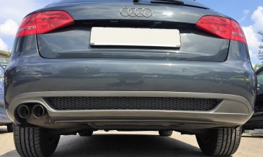 Диффузор заднего бампера Audi A4 B8 в стиле S-line с одним вырезом  фото