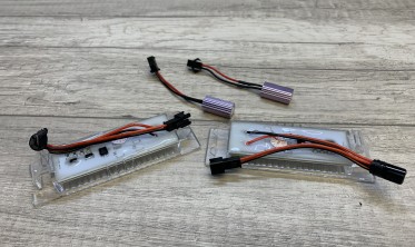 Подсветка номера Opel Astra H/J, Zafira B, Corsa D/C, Insignia, Meriva, Vectra C, Tigra B фото