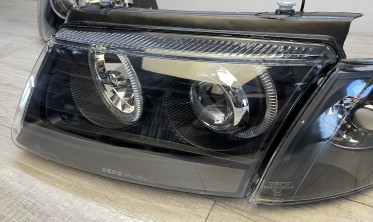 Передние фары VW Passat B5 фирмы Депо с кольцами черные фото