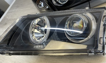 Передние фары VW Passat B5 фирмы Депо с кольцами черные фото