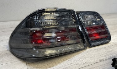 Тюнінгові ліхтарі задні Mercedes W210 тоновані фото