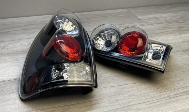 Чорні тюнінгові задні ліхтарі Chrysler Voyager, Dodge Caravan фото
