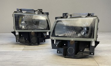 Передні галогенові фари VW T4 рест. 1996-2003 чорні без поворотів фото