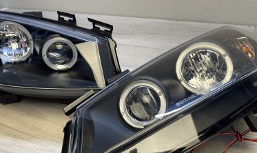 Чорні передні фари Renault Megane 2 з габаритами-кільцями фото