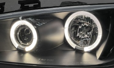 Чорні передні фари Renault Megane 2 з габаритами-кільцями фото