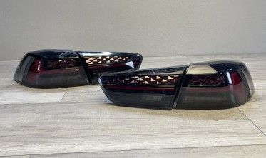 Задні ліхтарі Mitsubishi Lancer 10 тоновані стопи welcome lights фото