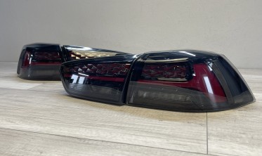 Задні ліхтарі Mitsubishi Lancer 10 тоновані стопи welcome lights фото