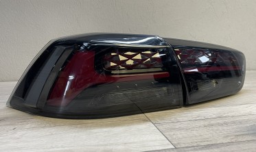 Задні ліхтарі Mitsubishi Lancer 10 тоновані стопи welcome lights фото